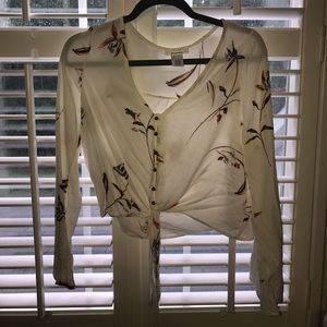 Crop. Floral/fern design bell sleeve top.